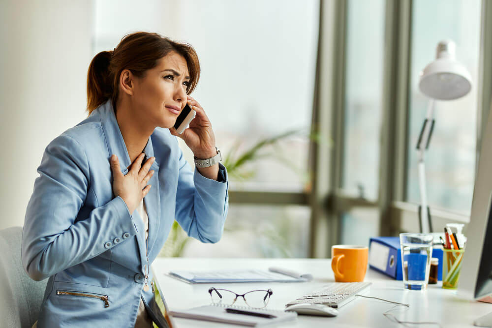 young-sad-businesswoman-receiving-bad-news-while-talking-mobile-phone-office-1.jpg