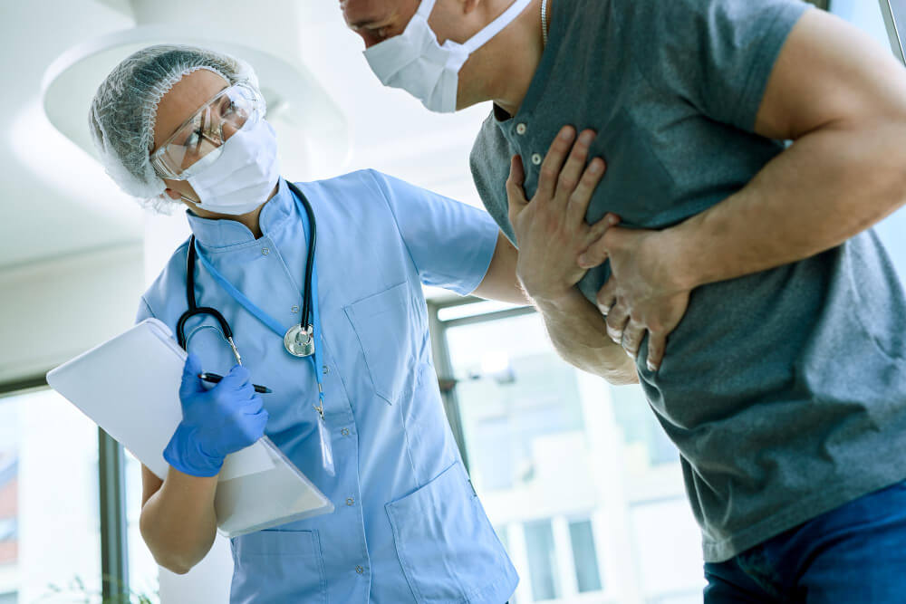 female-doctor-with-patient-who-is-complaining-chest-pain-during-coronavirus-epidemic-1-1.jpg
