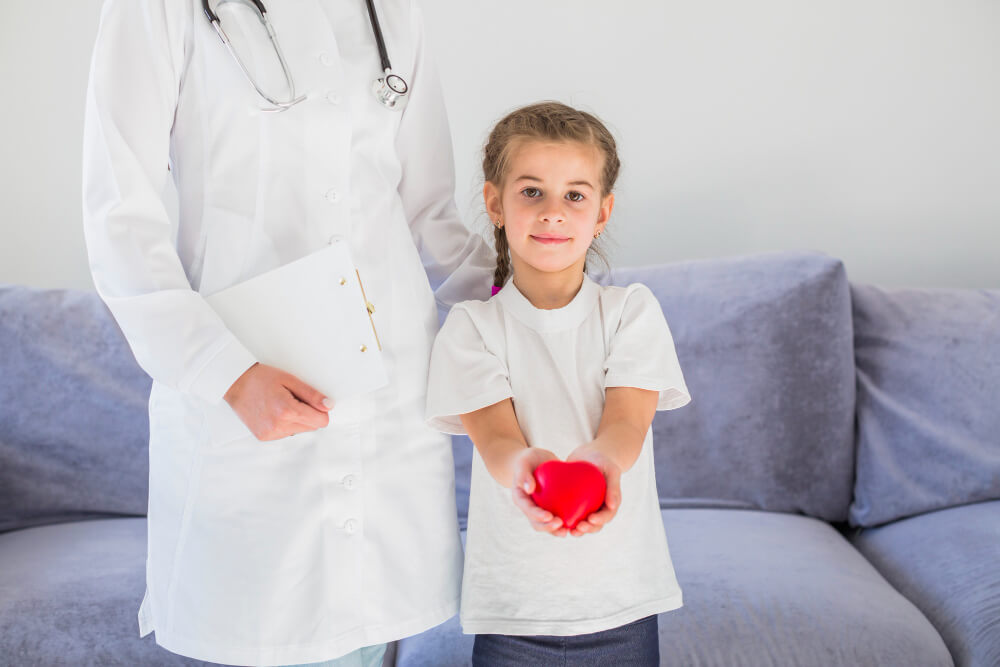 blonde-girl-holding-heart-with-doctor-1.jpg